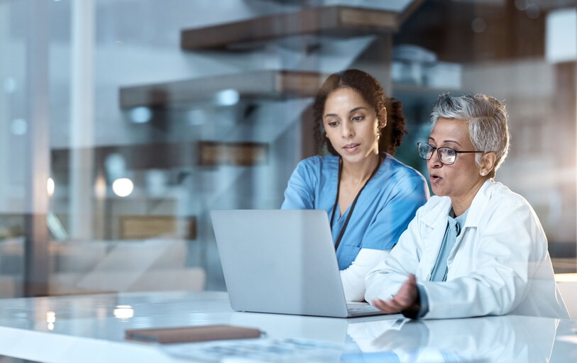 two women on a laptop